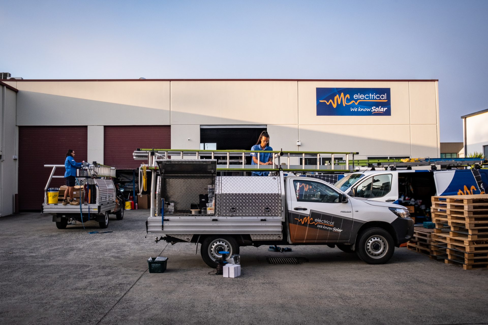 Queensland Electrician & Solar Panel Installer loading ladder on truck