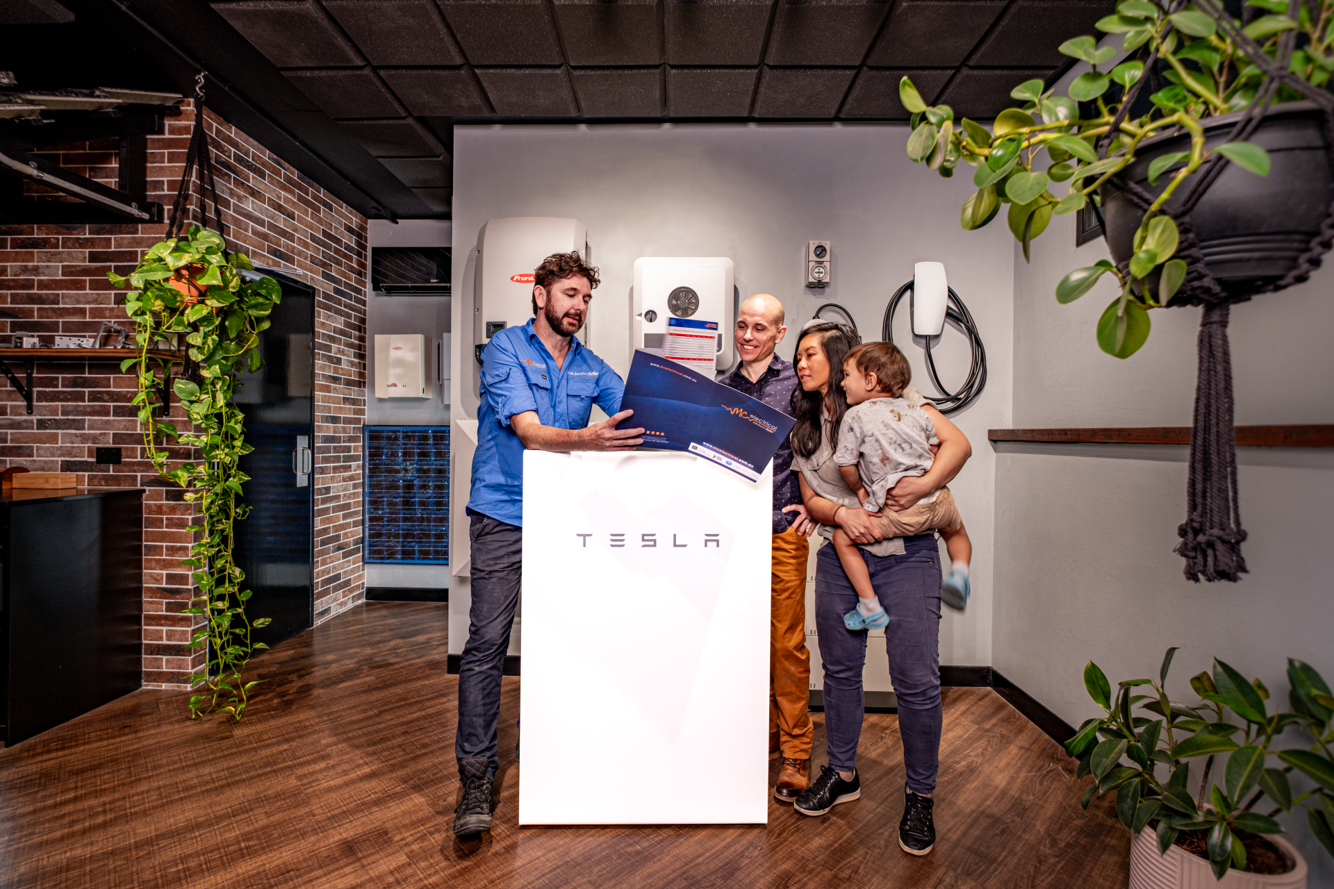 Mark showing family tesla solar battery