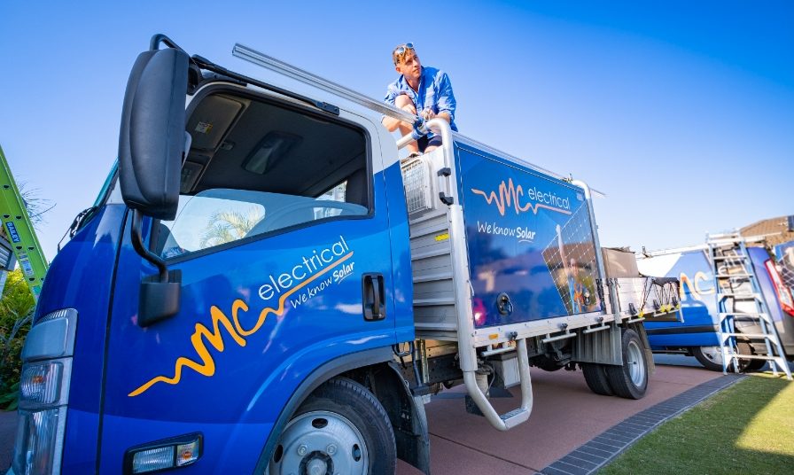 Queensland Electrician & Solar Panel Installer on top of truck
